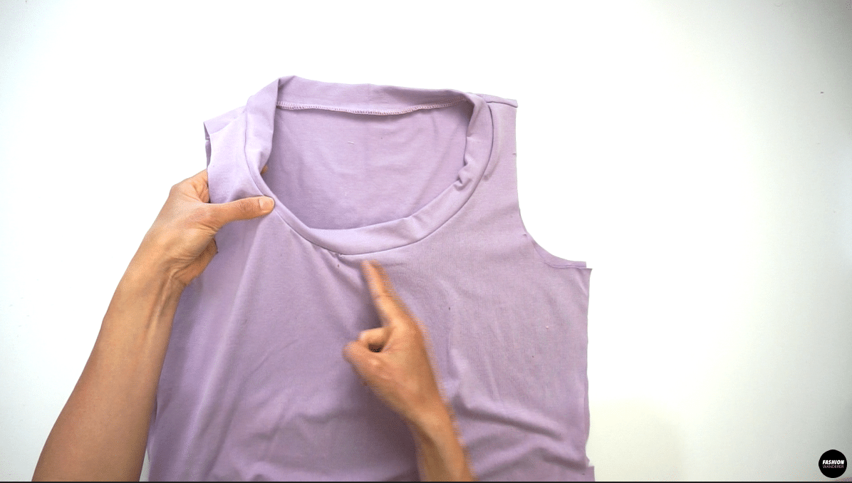 Overlock the neckband and neck opening. Fold the neckband inside so that you only see ¼” width neckband. This way you will cover the overlock seam for a clean finish.