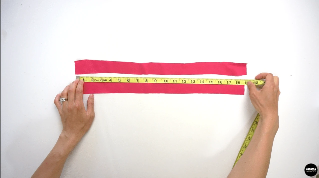 Cut 2 pieces of 1½” width by 19” long fabric straps that are cut on bias. Fold the straps right side facing each other and sew straight ½” width. Trim the seam allowance so the finished edges will be ⅛” width remaining. Use a loop turner to flip the strap inside out and iron the strap flat.