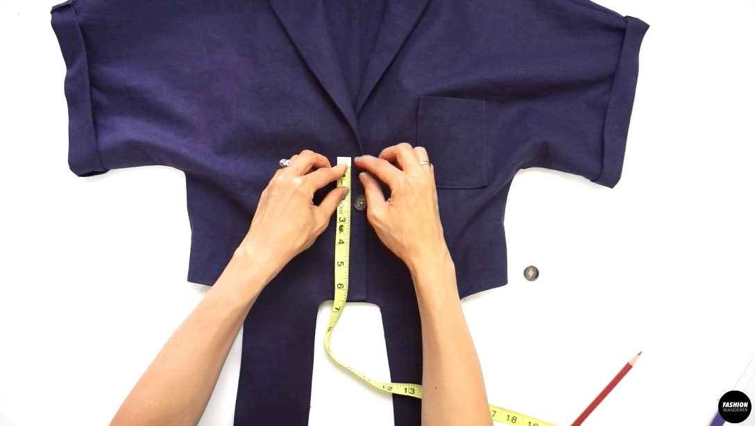 Place the right side of the Shirt on top of the left side of the Shirt and overlap, this will be your first button position to mark with chalk. Measure from center of the button placement 2” away for your next button and mark with chalk. 