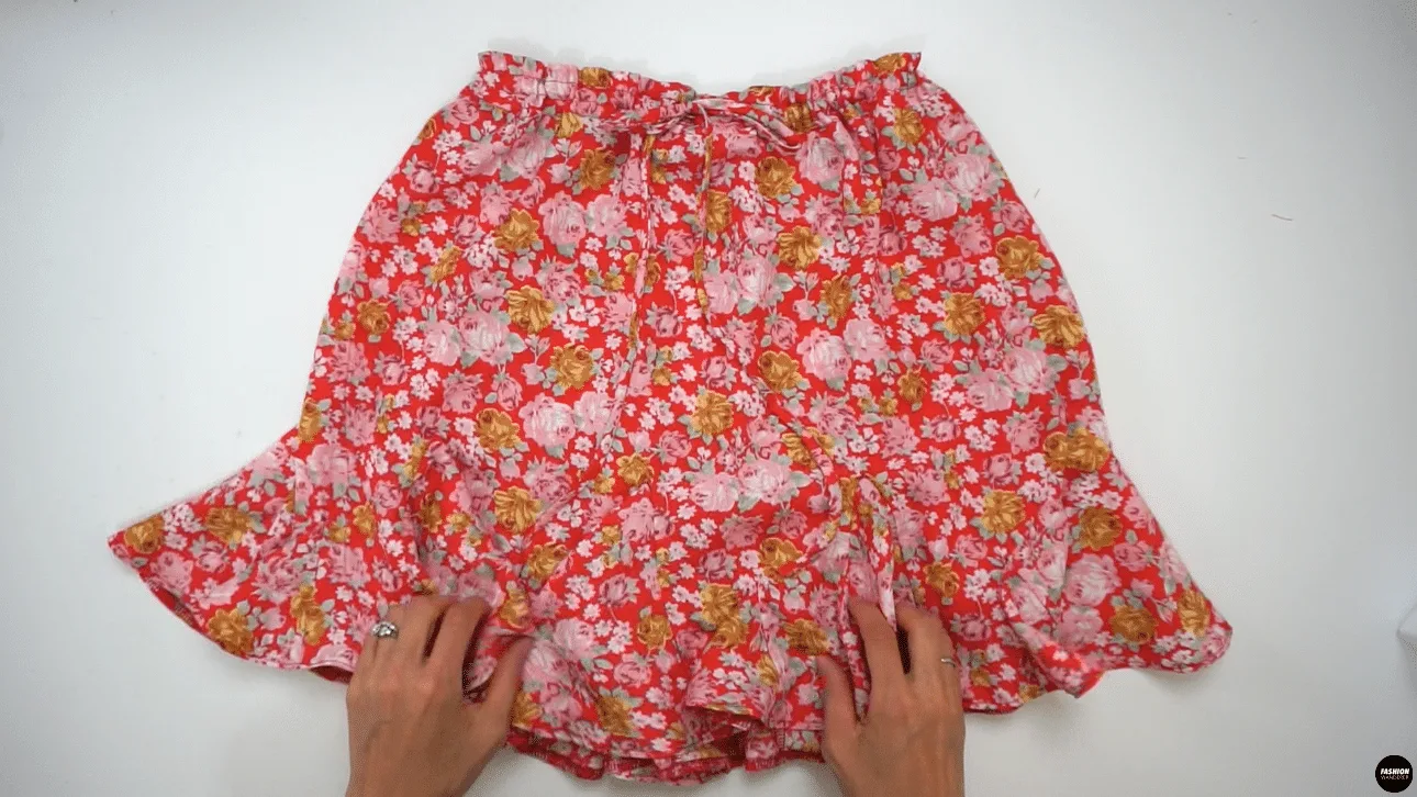 Adjust the gathering along the waist opening by tying a cute bow at center front to complete this Stella mini skirt. Give one last press all around and pair with any cropped length top as you wish.
