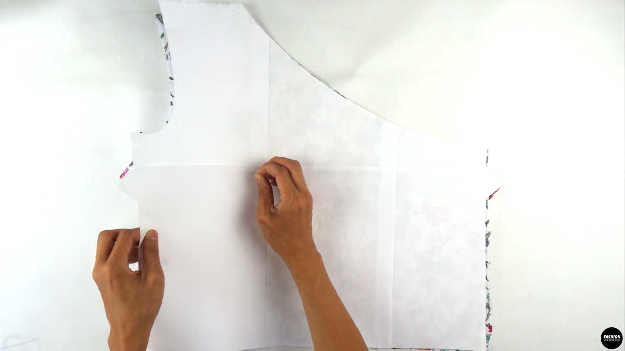 Flip the paper pattern to the wrong side and transfer the punched hole to the fabric.