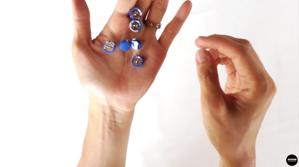 Use the template and cover button kit to attach the fabric onto the round button.