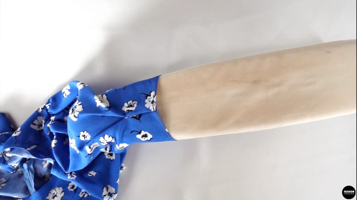 Open the tuck and press with iron for a tuck release look