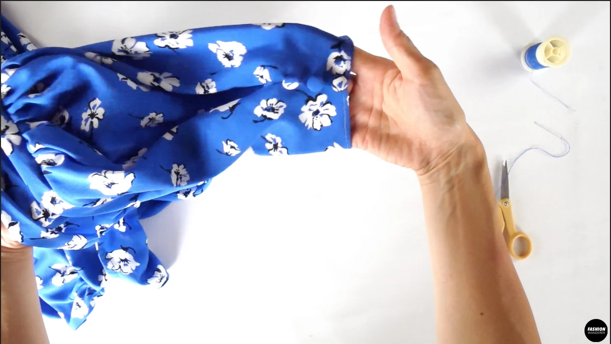 Hand sew 3 cover button pieces along the tuck on each sleeve