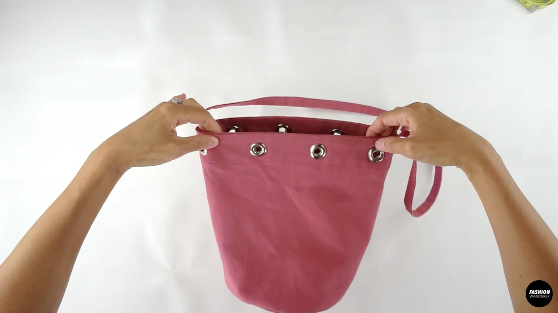 Grommets added around the bag opening.