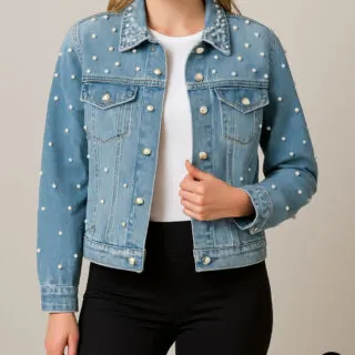 Front view of a woman wearing a blue denim jacket decorated with pearl beads on collar and sleeves