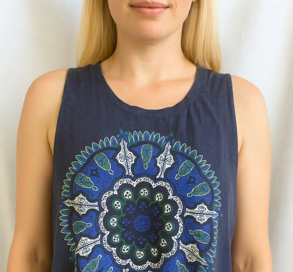 Front view of a blue mandala-printed muscle tank top made from a t-shirt, modeled by a blonde woman.