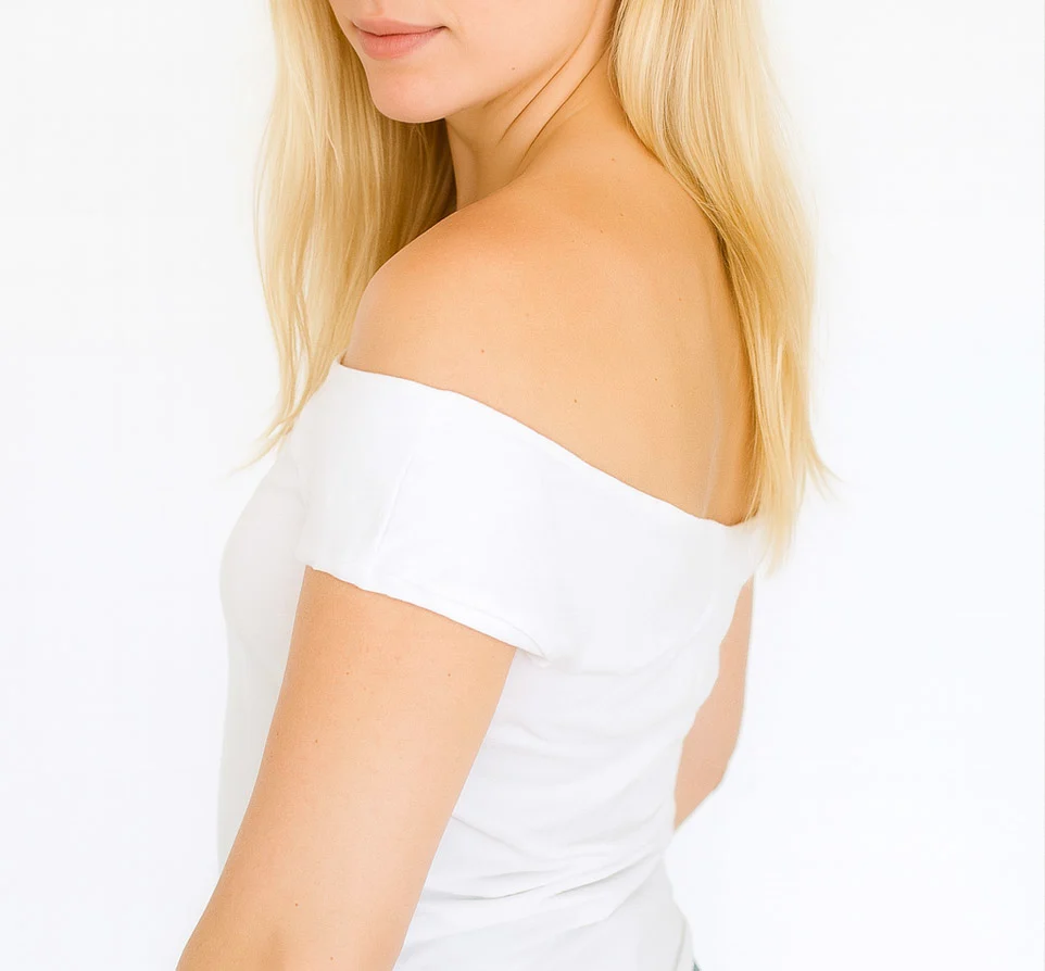 White off-shoulder t-shirt makeover modeled by a woman with straight blonde hair and minimal accessories.