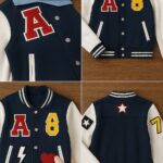 Navy varsity jacket with red letter A, yellow 8, heart, star, and lightning bolt patches applied to front and back panels.