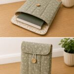 Padded DIY book sleeve sewn from sage green floral fabric with a button closure, a beginner-friendly sewing project for protecting books.